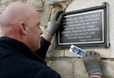 Fitting a plaque
